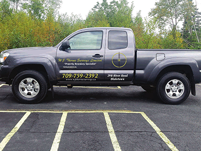 W. J. Thorne Surveys Limited company truck with phone number on the door panel